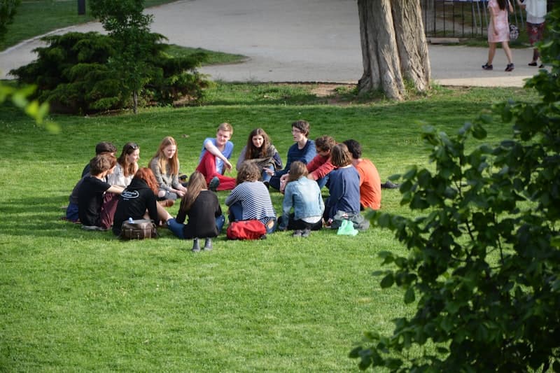 Community gathered in a circle outdoors